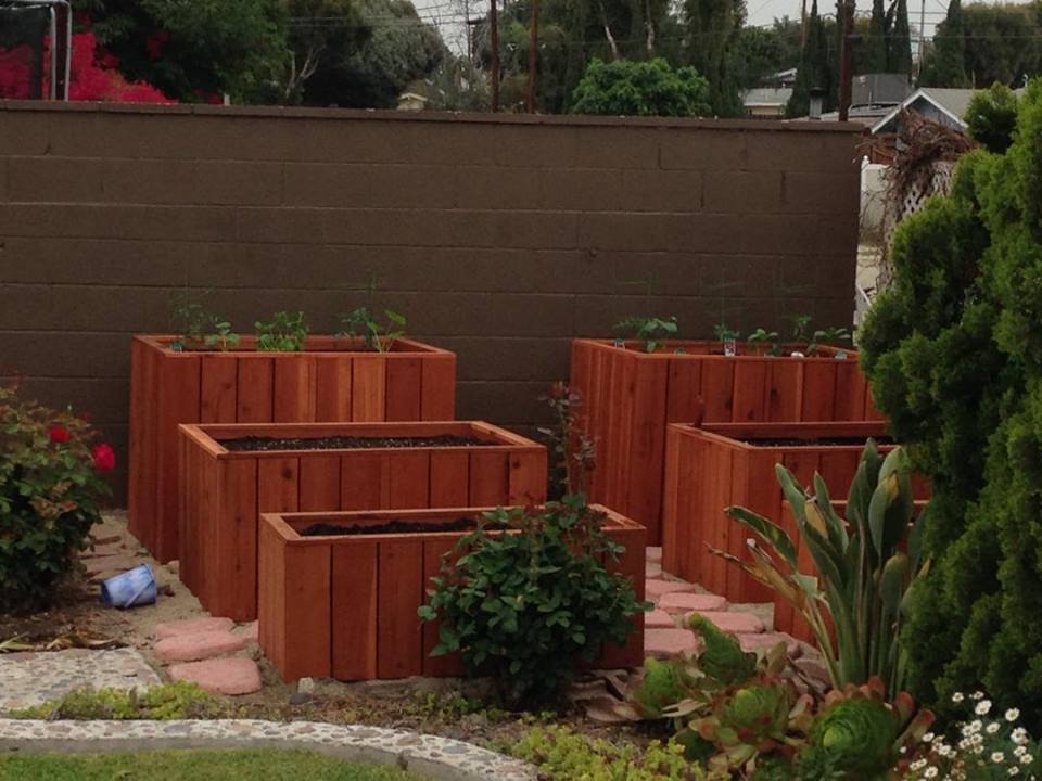 Custom built redwood three tiered planter garden.